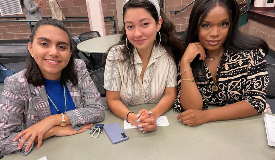 From left, Symone Burrell, a plaintiff in the lawsuit brought by 14 Rhode Island students advocating for a robust civics education, with Carina Sandoval and Michelle Alas, interns at the Rhode Island Center for Justice.