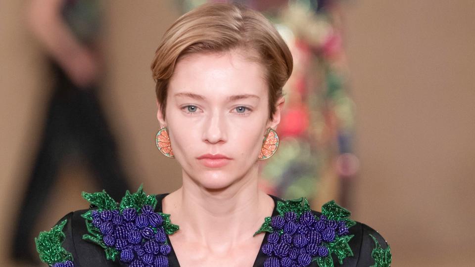  A model walks the runway during the Balmain Ready to Wear Fall/Winter 2024-2025 wearing a blazer adorned with beaded grapes