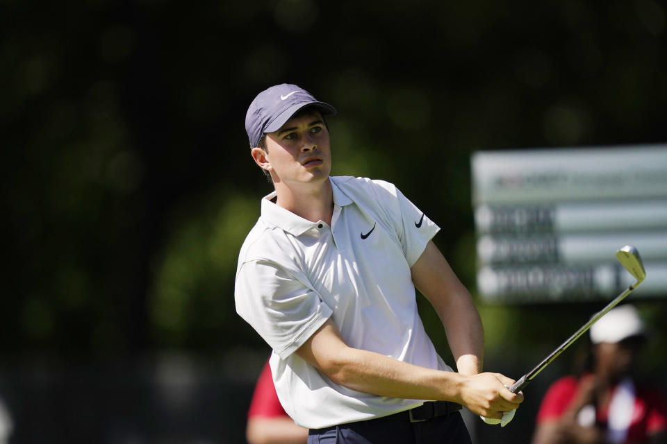 Davis Thompson watches his drive on the 11th tee during the second round of the Rocket Mortgage Classic golf tournament, Friday, July 2, 2021, at the Detroit Golf Club in Detroit. (AP Photo/Carlos Osorio)