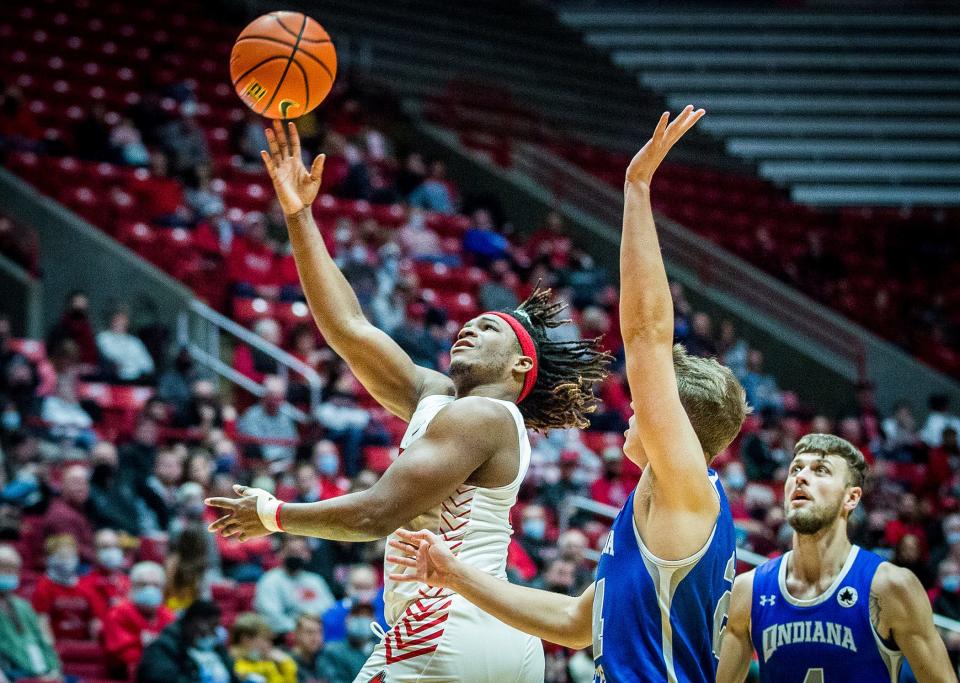 Ball State's Tyler Cochran shoots past Indiana State's defense during their game at Worthen Arena Saturday, Nov. 27, 2021.