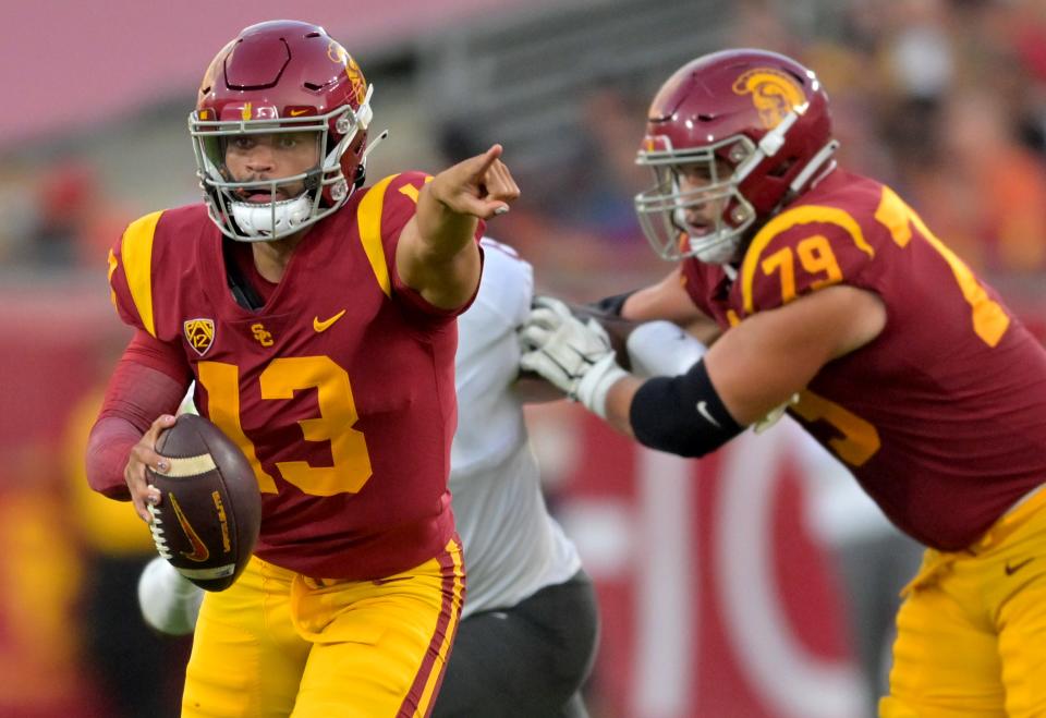 USC Trojans quarterback Caleb Williams (13) directs a play against the Washington State Cougars in the first half at United Airlines Field at Los Angeles Memorial Coliseum.