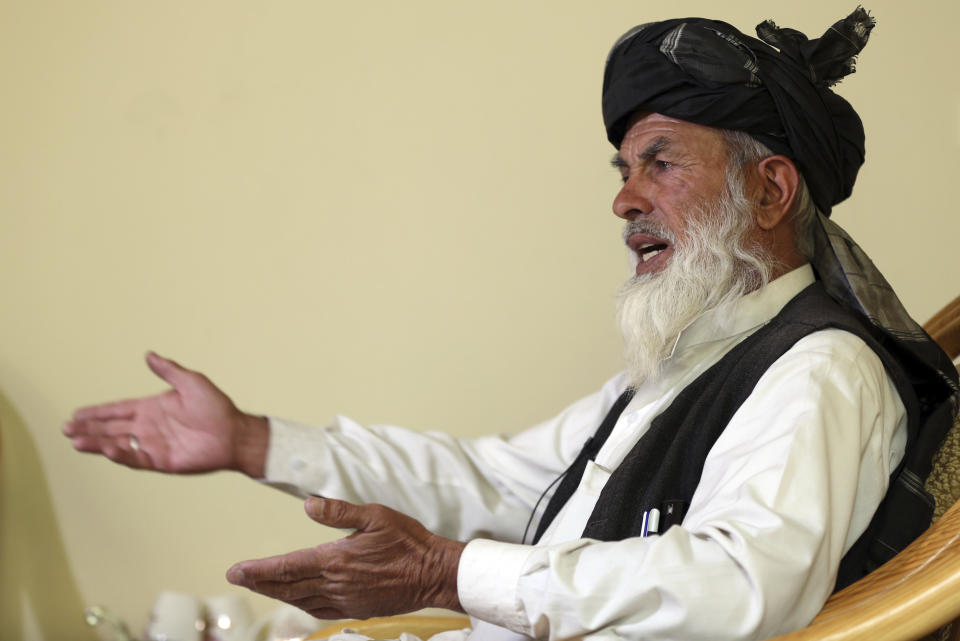 In this Monday, Oct. 15, 2018 photo, Khaki Jan Zadran, a former member of the eastern Paktia provincial council speaks during an interview with The Associated Press, in Kabul, Afghanistan. Zadran said most women in his province are not allowed by the men in their family to have their pictures taken or even have their names written on a public document, which means many are unregistered. (AP Photo/Massoud Hossaini)