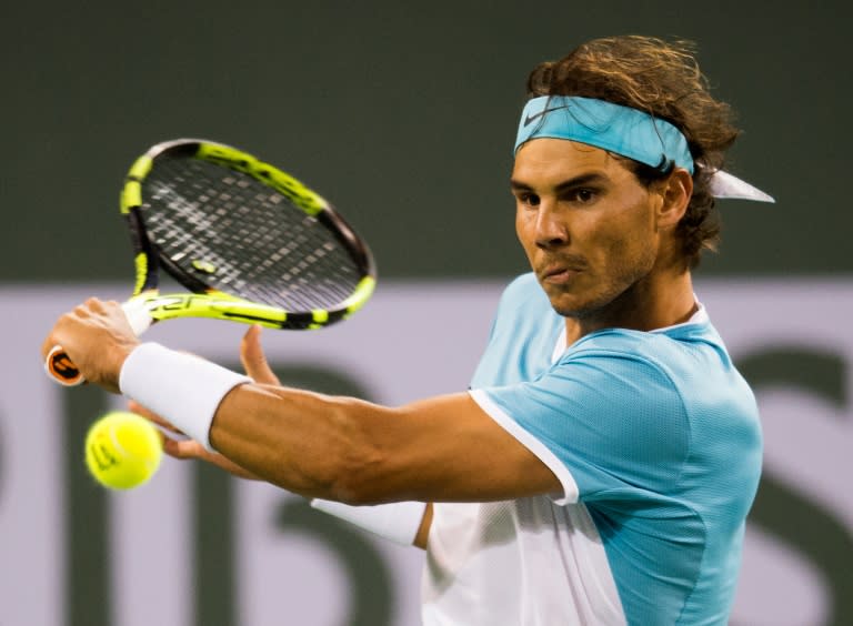 Rafael Nadal of Spain returns a shot to Gilles Muller of Luxembourg during their BNP Paribas Open second round match, at the Indian Wells Tennis Garden in California, on March 13, 2016