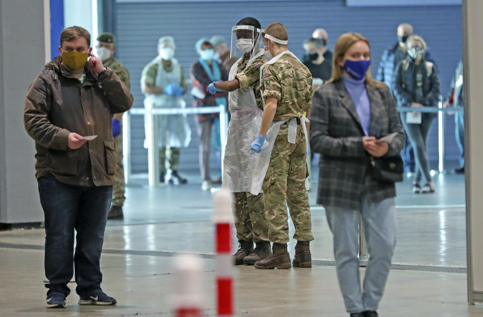 Soldiers direct people at The Exhibition Centre in Liverpool, which has been set up as a testing centre as part of the mass Covid-19 testing in Liverpool.