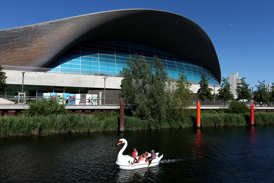 LONDON, ENGLAND  - MAY 31: People in pedalo's go through the Olympic Park in Stratford on May 31, 2020 in London, England. The British government continues to ease the coronavirus lockdown by announcing schools will open to reception year pupils plus years one and six from June 1st. Open-air markets and car showrooms can also open from the same date.  (Photo by Alex Pantling/Getty Images)