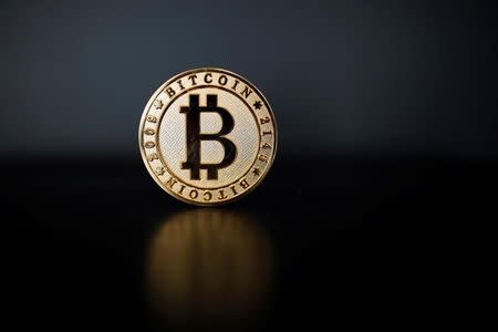 Bitcoin touches fresh record, $12,000 in sight