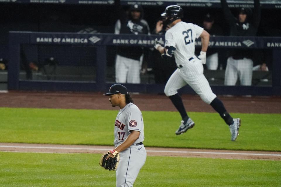 Houston Astros starting pitcher Luis Garcia (77) reacts as New York Yankees' Giancarlo Stanton (27) runs the bases after hitting a two-run home run during the third inning of a baseball game Wednesday, May 5, 2021, in New York. (AP Photo/Frank Franklin II)