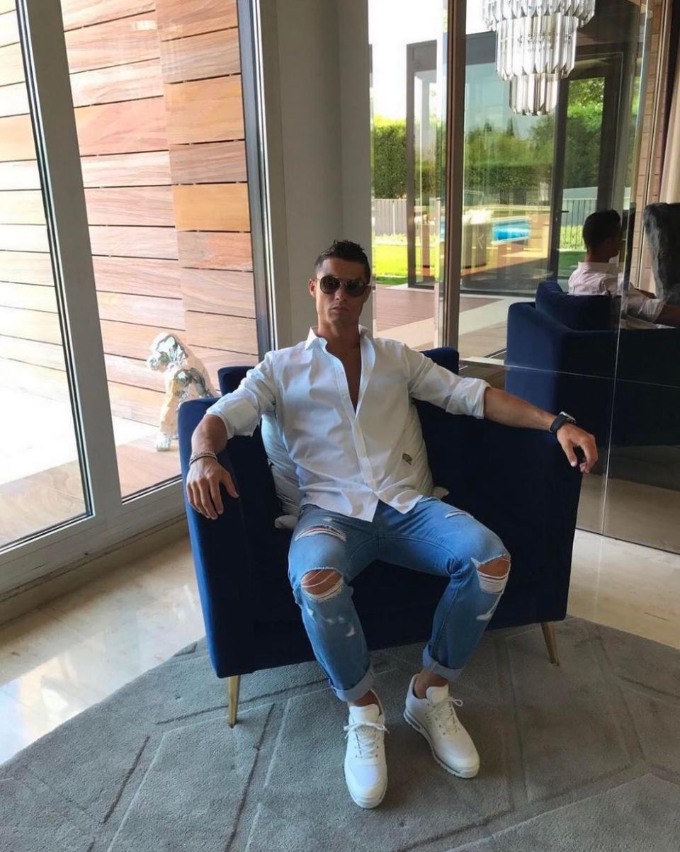 The sun lounge: Ronaldo relaxes in one of his thrones