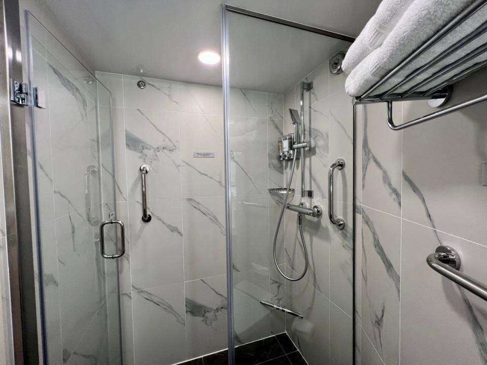 White marble Shower in cruise ship bathroom