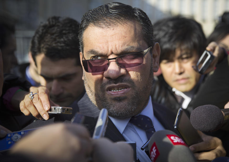 Anas al-Abdeh, center, a member of the Syrian National Coalition, Syria's main political opposition group, is surrounded by journalists after a meeting with a delegation of the Syrian government at the United Nations headquarters in Geneva, Switzerland, Saturday, Jan. 25, 2014. The Syrian government and the country's opposition held direct talks on Saturday for the first time since they entered into a war three years ago, the UN said. (AP Photo/Anja Niedringhaus)