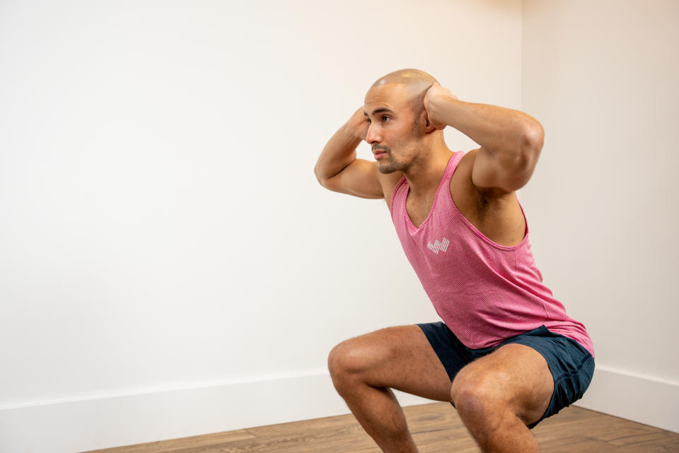 WithU trainer Omar Mansour performing a squat