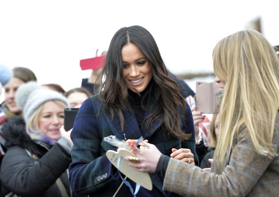 Meghan greets the crowd of well-wishers.