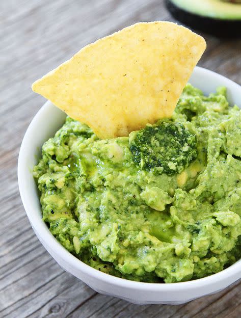 <strong>Get the <a href="http://www.twopeasandtheirpod.com/pesto-guacamole/" target="_blank">Pesto Guacamole recipe</a> from Two Peas and their Pod</strong>