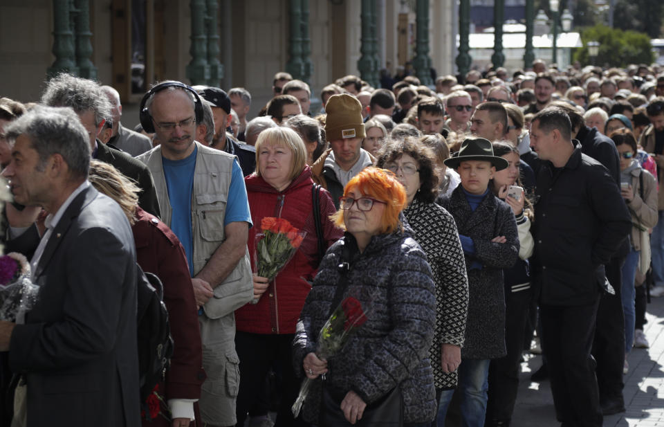 People line up to pay the last respects at the coffin of former Soviet President Mikhail Gorbachev outside the Pillar Hall of the House of the Unions during a farewell ceremony in Moscow, Russia, Saturday, Sept. 3, 2022. Gorbachev, who died Tuesday at the age of 91, will be buried at Moscow's Novodevichy cemetery next to his wife, Raisa, following a farewell ceremony at the Pillar Hall of the House of the Unions, an iconic mansion near the Kremlin that has served as the venue for state funerals since Soviet times. (AP Photo)