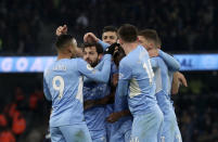 Manchester City's Fernandinho celebrates with teammates after scoring his side's second goal during the English Premier League soccer match between Manchester City and West Ham United at the Etihad stadium in Manchester, England, Sunday, Nov. 28, 2021. (AP Photo/Scott Heppell)