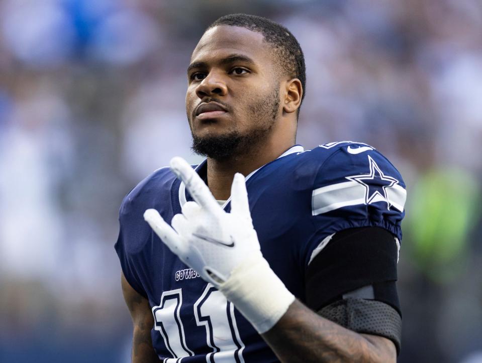 Micah Parsons makes a gesture with his hands during a Cowboys game.