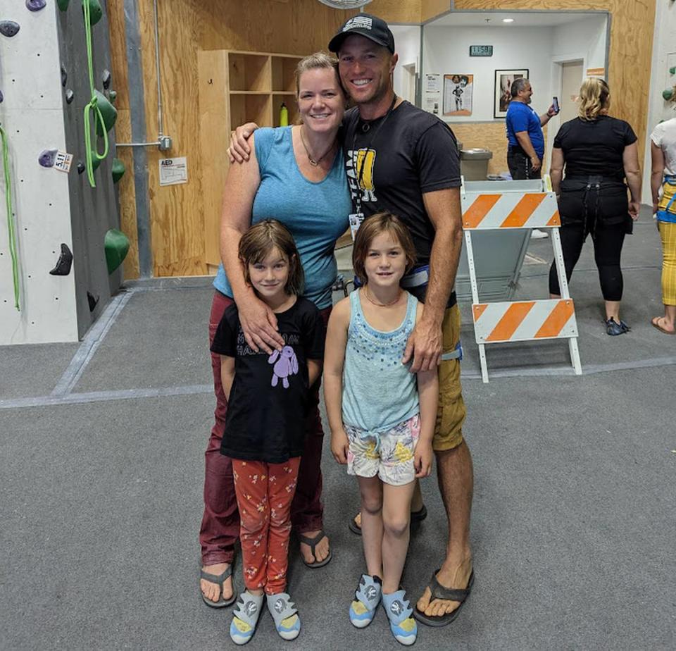 Pad Climbing gym co-owners Kristin Tara Horowitz and Yishai Horowitz and their children, Gaby and Keila, pose for a photo near one of the gym’s many climbing surfaces. Horowitz said her family owns a home in Los Osos, resulting in commutes that keep her away from her business.