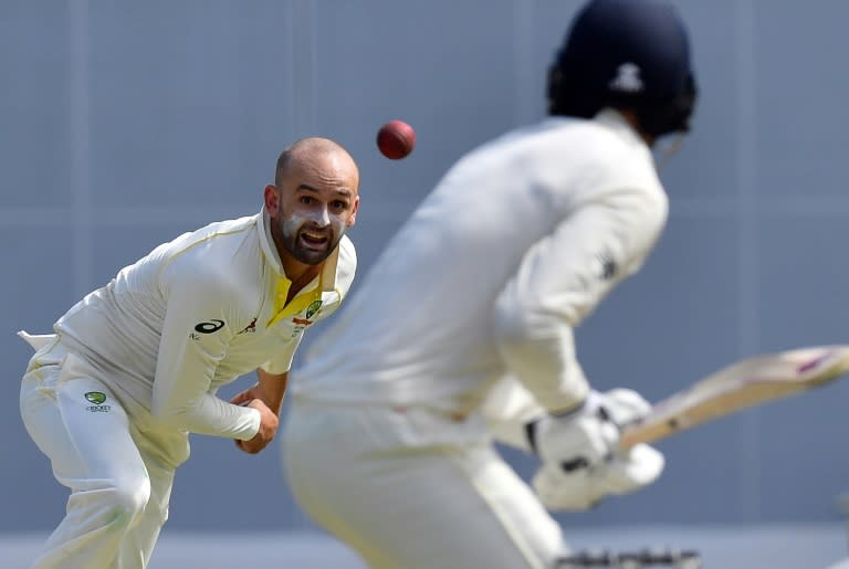 Australia's Nathan Lyon (left) bowls to England's James Vince on the first day of the first Ashes Test in Brisbane, on November 23, 2017