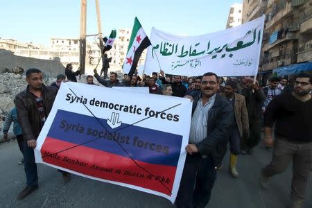 People attend a protest against forces loyal to Syria's President Bashar al-Assad, Russia and the Syrian Democratic forces, in Tariq al-Bab neighbourhood of Aleppo, Syria, February 29, 2016. REUTERS/Abdalrhman Ismail