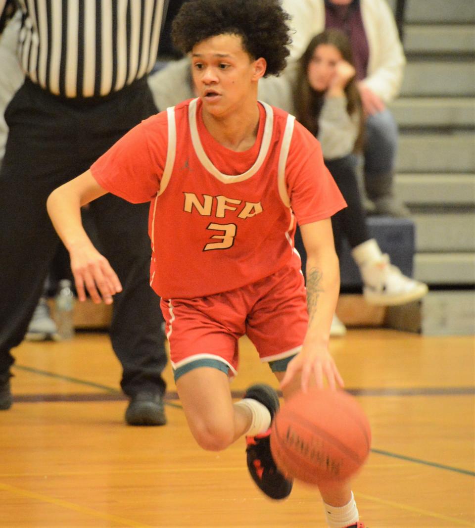 NFA senior Eshaad Hernandez drives to the basket against Windham during the ECC tournament Thursday in Willimantic.
