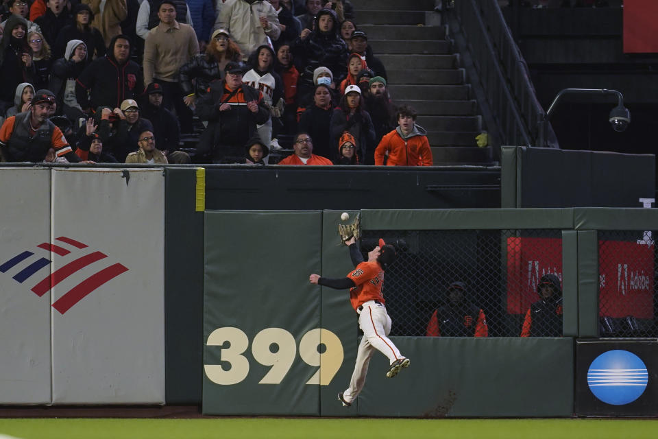 San Francisco Giants center fielder Mike Yastrzemski catches a fly ball hit by Chicago White Sox's Yoan Moncada during the fifth inning of a baseball game in San Francisco, Friday, July 1, 2022. (AP Photo/Eric Risberg)