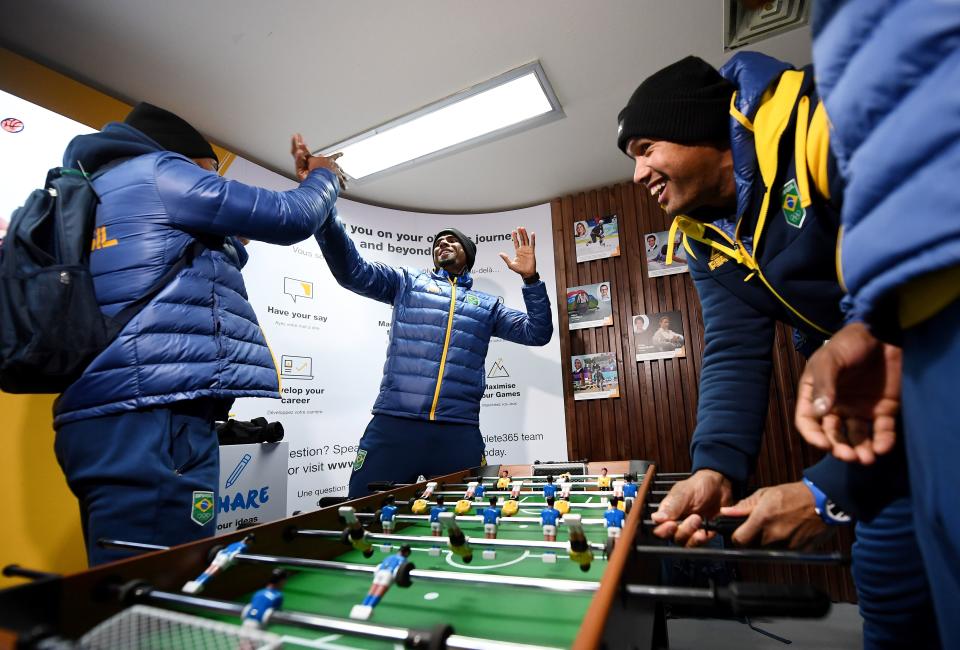 <p>Members of the Brazilian team react during a game of baby foot at the Olympic Village ahead of the PyeongChang 2018 Winter Olympic Games. (FRANCK FIFE/AFP/Getty Images) </p>