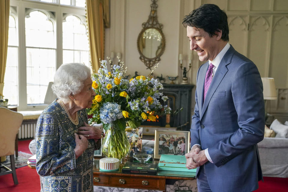 Britain's Queen Elizabeth II (L) speaks with Canadian Prime Minister Justin Trudeau