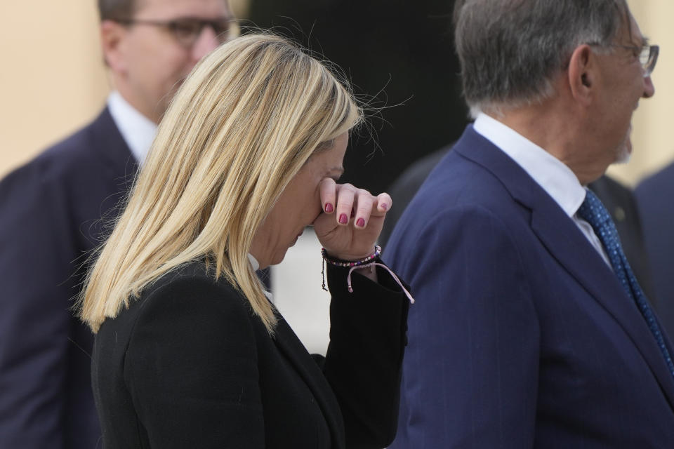 Italian Premier Giorgia Meloni gestures as she attends a ceremony to mark Italy's Liberation day at the unknown soldier monument, in Rome, Tuesday, April 25, 2023. The anniversary marks the day in 1945 when the Italian resistance movement proclaimed an insurgency as the Allies were pushing German forces out of the peninsula. (AP Photo/Gregorio Borgia)