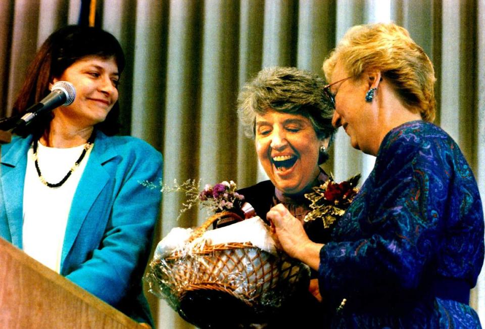 Mayor Anne Rudin received a gift from Sacramento City Council members Heather Fargo, left, and Lynn Robie at a community luncheon honoring the mayor in 1992. They gave her a basket filled with bubble bath, soap and a romance novel.