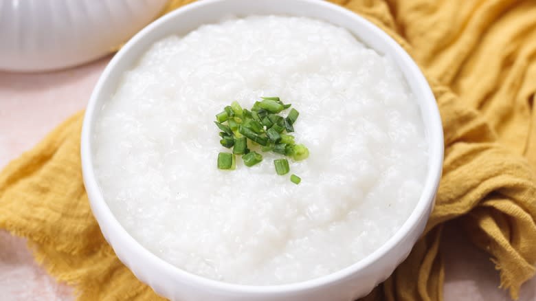 Plain congee with chive garnish
