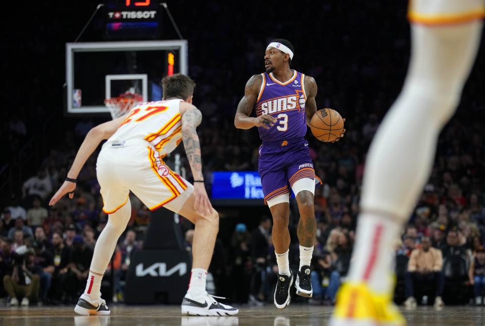 Suns guard Bradley Beal (3) dribbles up the court against Hawks guard Vit Krejci (27) during a game at the Footprint Center.