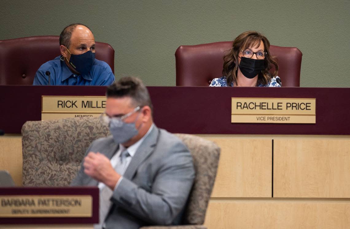 Rocklin Unified School District Board of Education Vice President Rachelle Price, center, and board member Rick Miller, left, listen to a public speaker during a meeting in 2021.