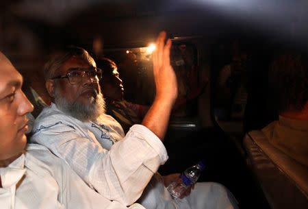 Ali Ahsan Mohammad Mujahid, deputy chief of Bangladesh Jamaat-e-Islami waves from a car as police arrest him in Dhaka in this file June 29, 2010 photo. REUTERS/Andrew Biraj