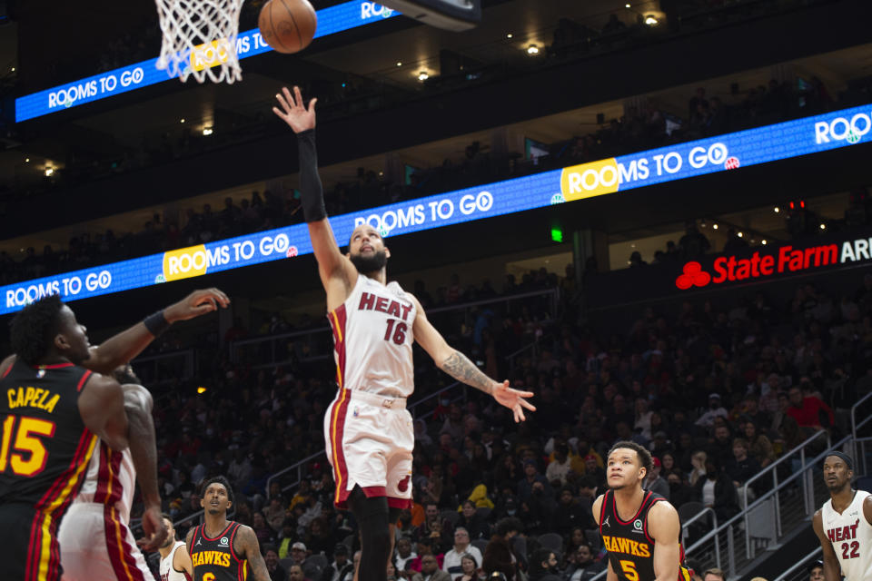 Miami Heat forward Caleb Martin (16) scores during the second half of an NBA basketball game against the Atlanta Hawks, Friday, Jan. 21, 2022, in Atlanta. (AP Photo/Hakim Wright Sr.)