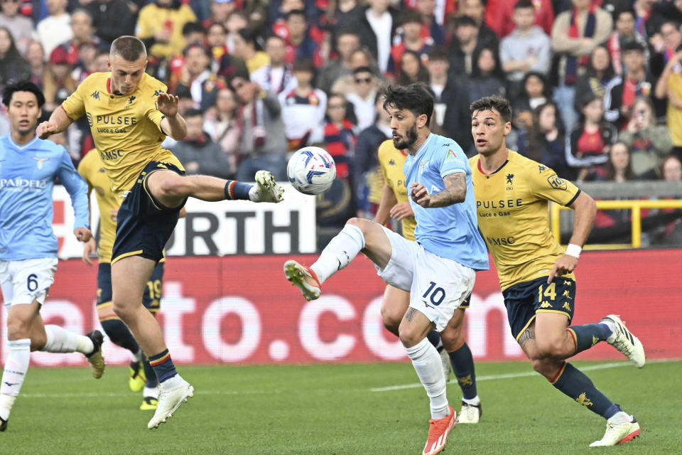 Genoa's Albert Gudmundsson, left, fights for the ball with Lazio's Luis Alberto, number 10, during the Serie A soccer match between Genoa and Lazio at the Luigi Ferraris Stadium in Genoa, Italy, Friday, April 19, 2024. (Tano Pecoraro/LaPresse via AP)