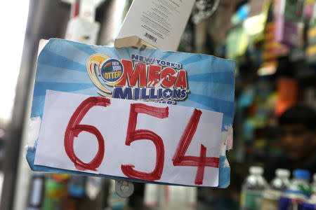 A Sign displays the jackpot for Tuesday's Mega Millions drawing after it rose over $650 million in New York City, New York, U.S., October 16, 2018. REUTERS/Mike Segar