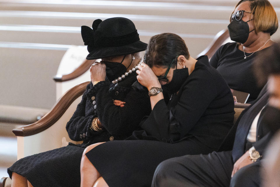 Family members, including Billye Aaron, left, and Ceci Aaron, second from left, weep during the funeral services the funeral services for Henry "Hank" Aaron, longtime Atlanta Braves player and Hall of Famer, on Wednesday, Jan. 27, 2021 at Friendship Baptist Church in Atlanta. (Kevin D. Liles/Atlanta Braves via AP, Pool)