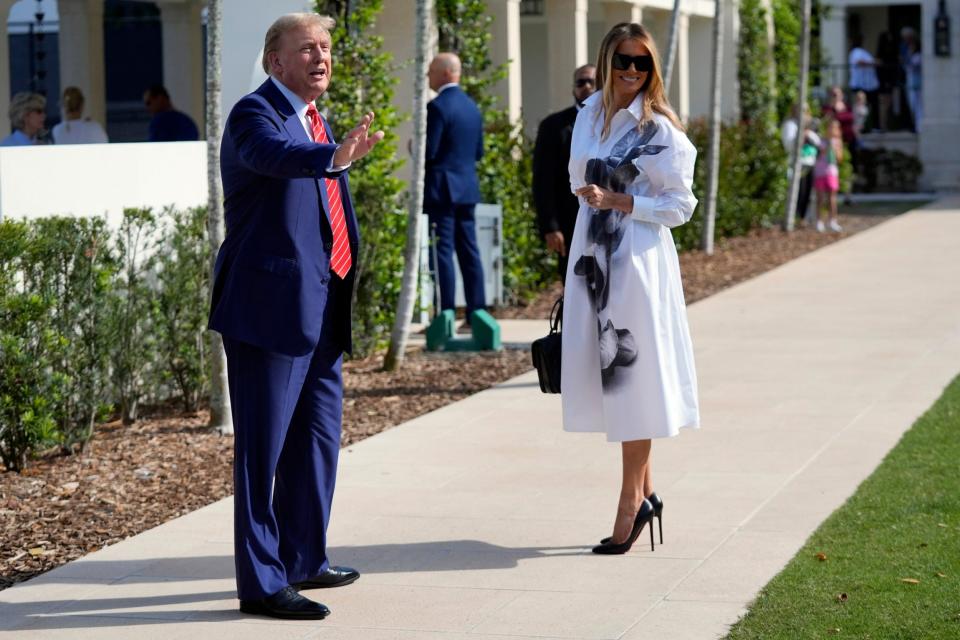 Melania Trump wore a white Alexander McQueen shirt dress adorned with a giant flower print