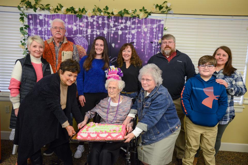 Claribel Herndon poses for a photo with family alongside her birthday cake during Herndon's upcoming 104th birthday celebration insode Brookdale Jackson Oaks in Jackson, Tenn., on Wednesday, Jan. 3, 2024.