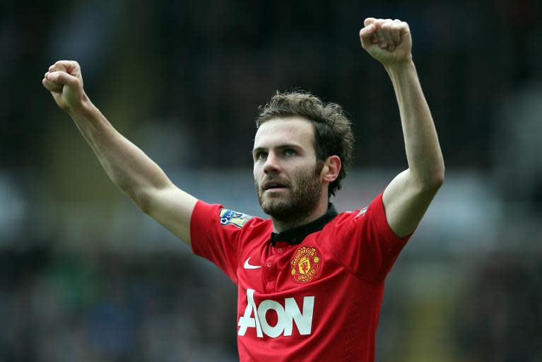 Manchester United's midfielder Juan Mata celebrates scoring his second goal during an English Premier League football match against Newcastle United at St James' Park in Newcastle Upon Tyne, northeast England on April 5, 2014