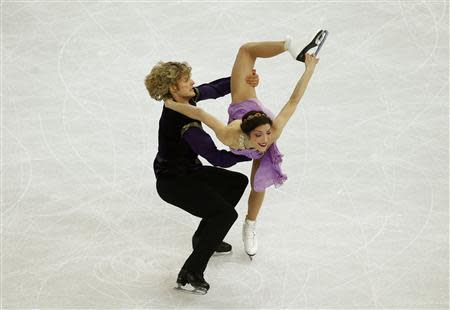 Meryl Davis and Charlie White of the U.S. compete during the Figure Skating Ice Dance Free Dance Program at the Sochi 2014 Winter Olympics, February 17, 2014. REUTERS/Marko Djurica