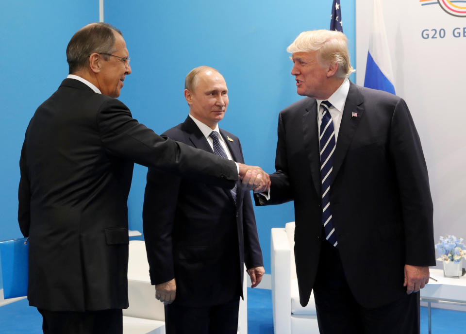 Russian Foreign Minister Sergey Lavrov, Russian President Vladimir Putin, and U.S President Trump during the G-20 summit in Hamburg, Germany, in July 2017. (Photo: Mikhail Klimentyev, Kremlin Pool Photo via AP)