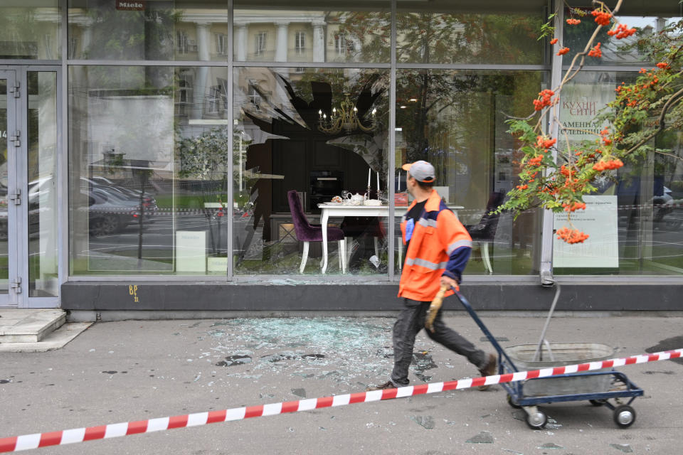 A man walks past a damaged building after a reported drone attack in Moscow, Russia, Monday, July 24, 2023. (AP Photo)