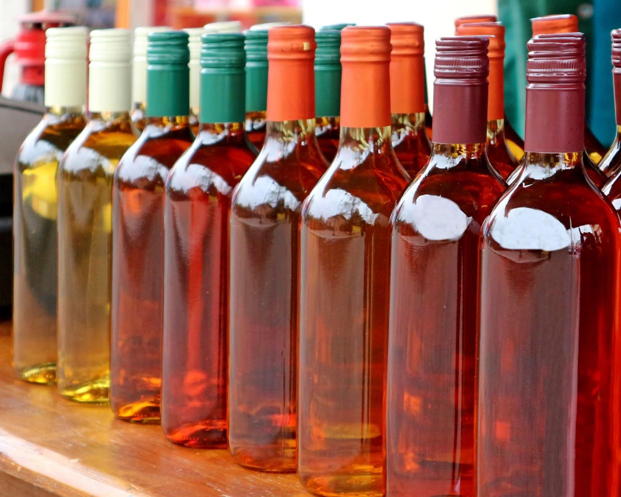 homemade mead bottles on the shelf of an outdoor market