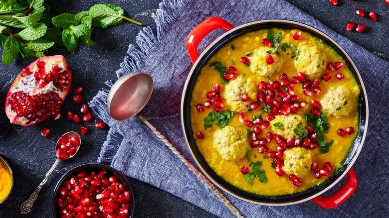 Soup garnished with pomegranate seeds