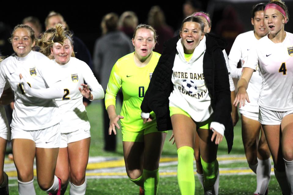 Notre Dame players rejoice after the win as Notre Dame defeated Cooper 3-0 in the KHSAA 9th Region girls soccer final Oct. 14, 2023 at Notre Dame Academy.