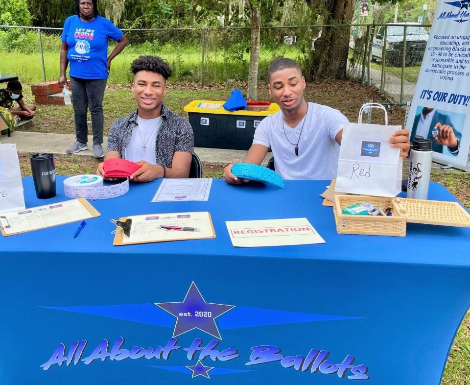 Volunteers at the All About the Ballots booth at the 2021 Juneteenth celebration in Mount Dora.