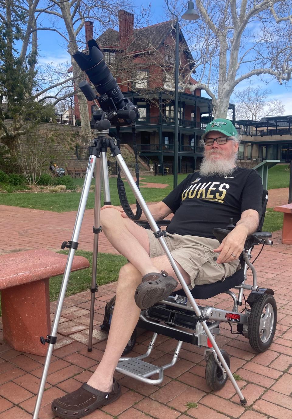 George Steinfeldt, retired photography teacher from Harry S Truman High School, awaits the solar eclipse at the Grundy library in Bristol.