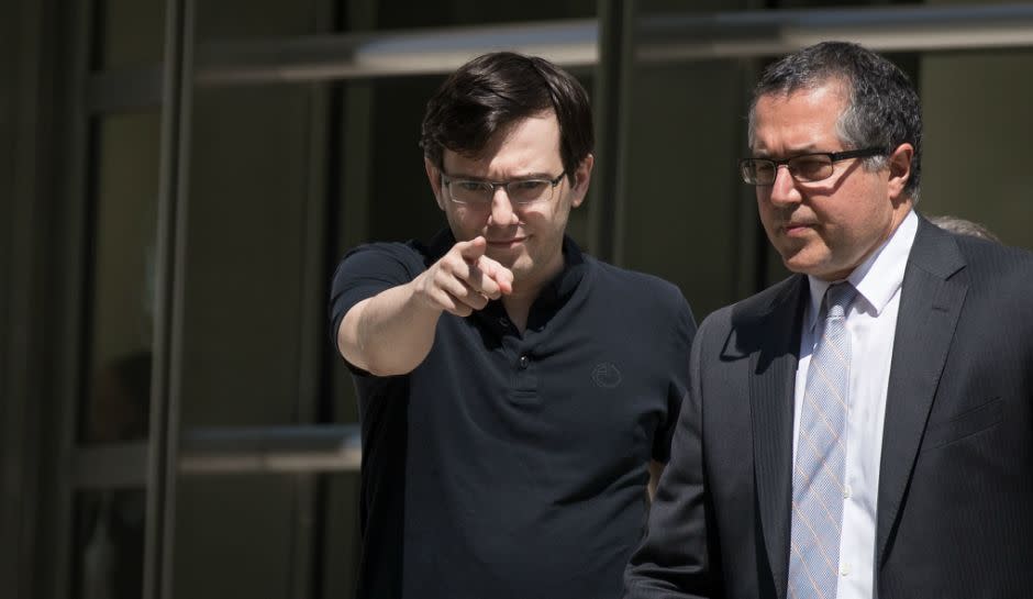 Former pharmaceutical executive Martin Shkreli points as he exits the courthouse after the jury issued a verdict in his case at the U.S. District Court for the Eastern District of New York