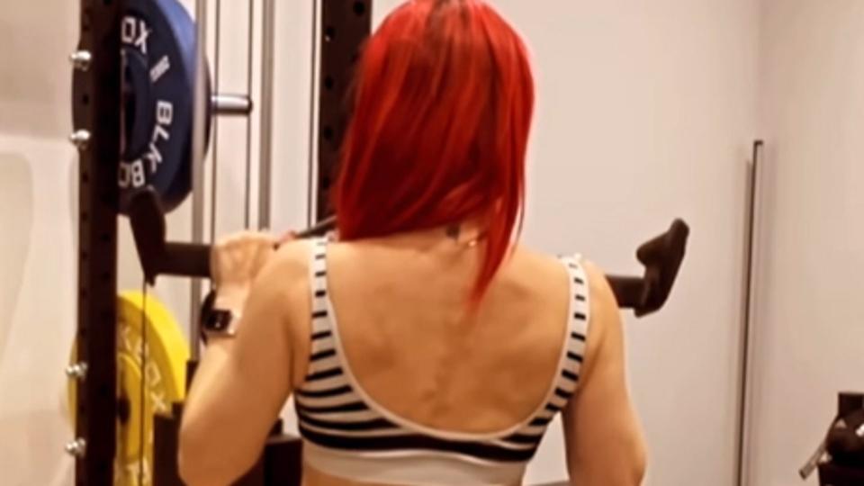 Dianne Buswell in the gym in a checkerboard outfit